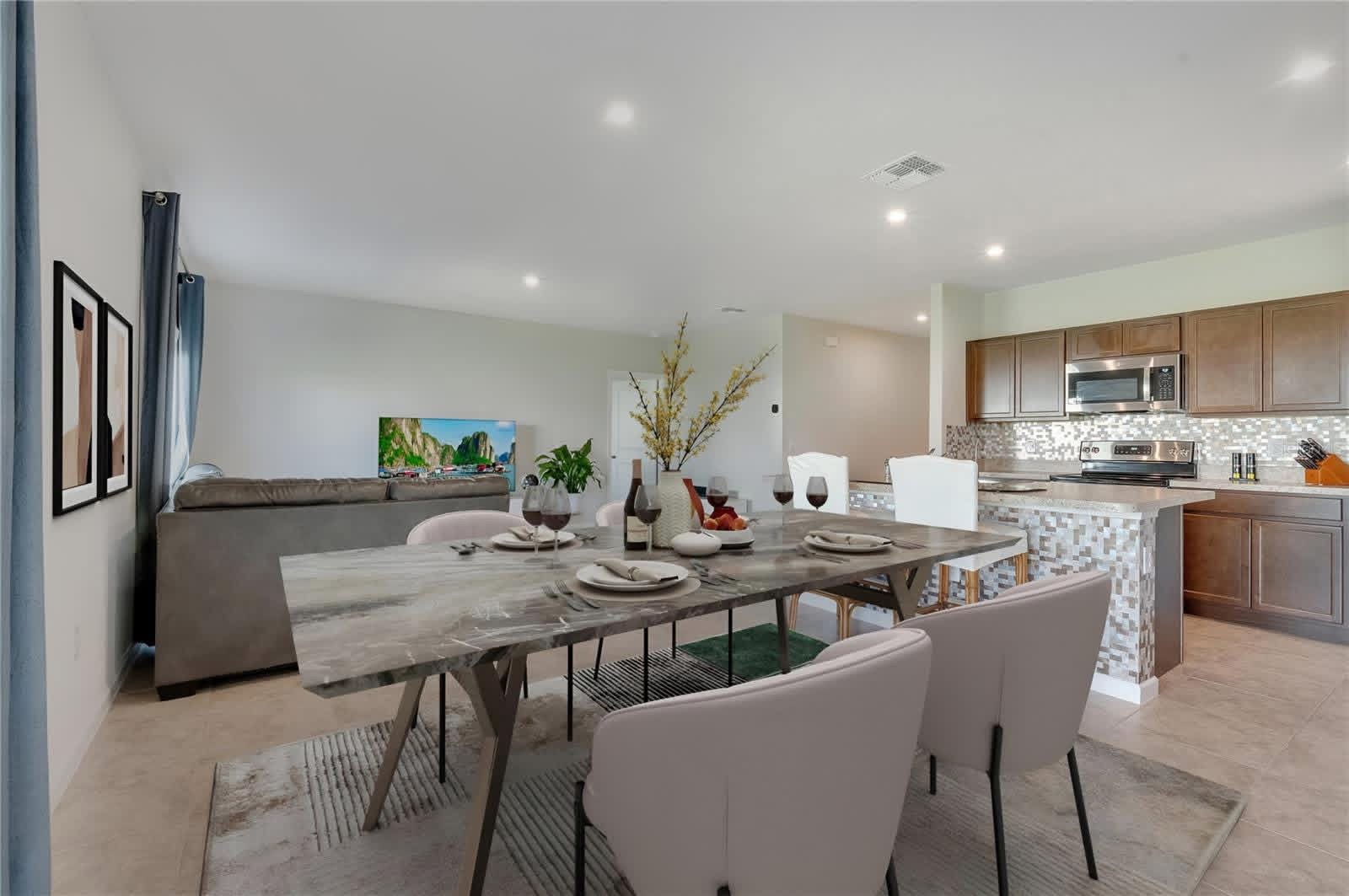A bright, open living and dining area inside one of the homes