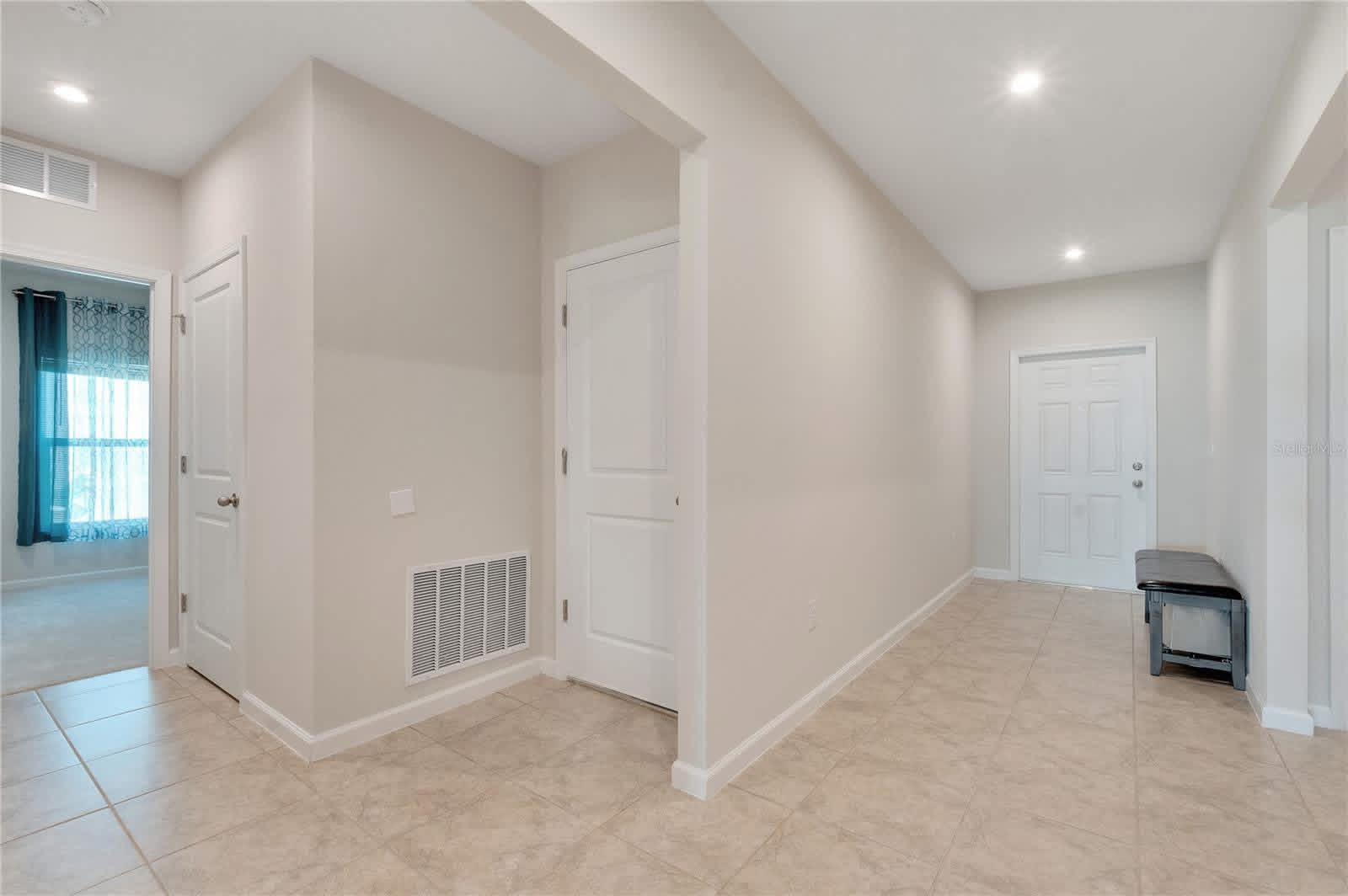A bright, tiled front entryway inside one of the homes